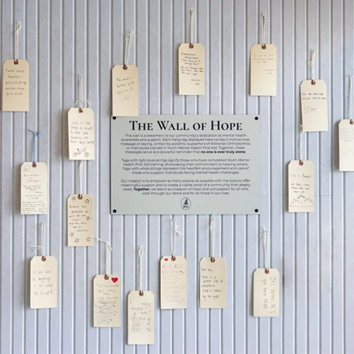 Patients and supporters adding messages to the Wall of Hope at Wiktorski Orthodontics