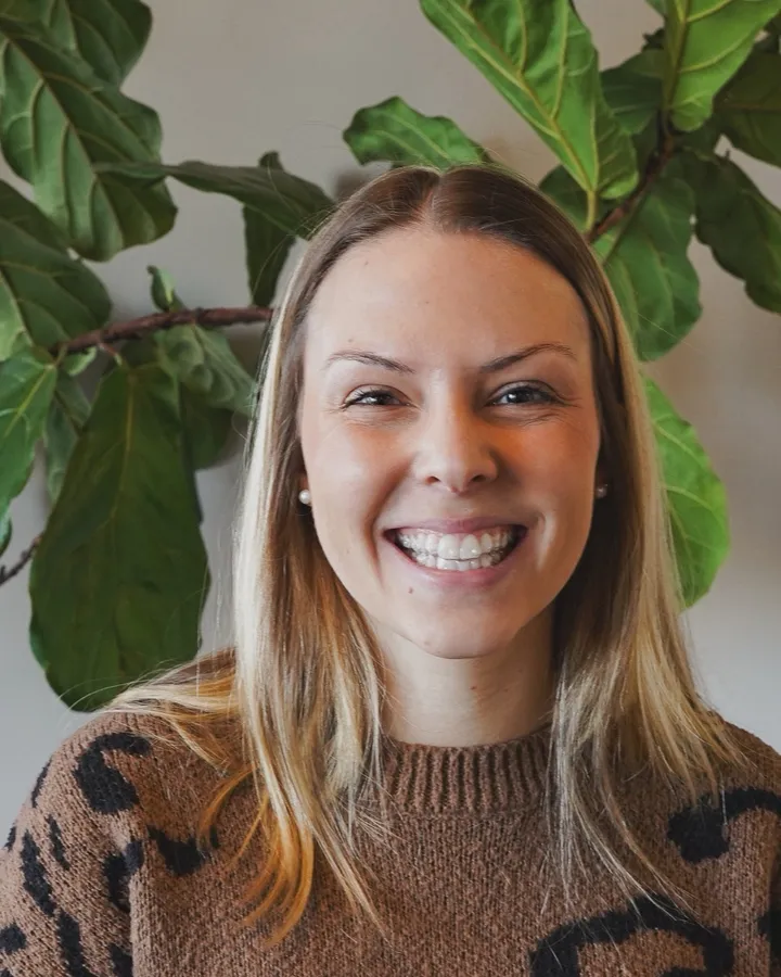 A smiling adult Invisalign patient at Wiktorski Orthodontics
