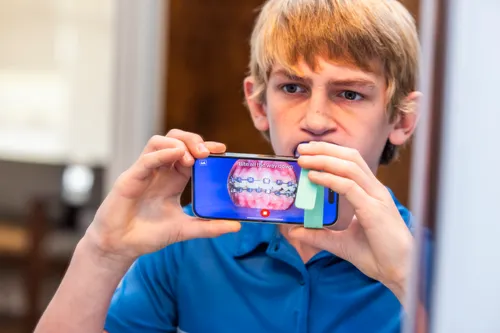 Teen braces patient checking in remotely through WO On The Go