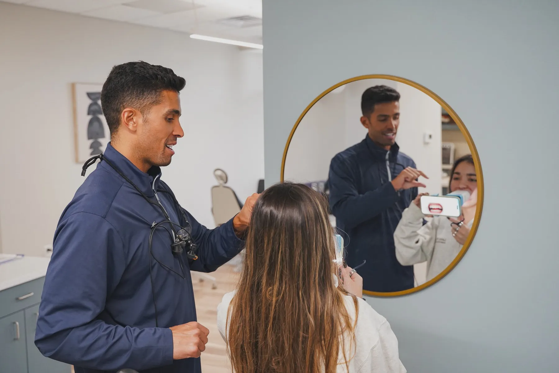 Dr. Wiktorski coaching a patient through a WO On The Go smile scan