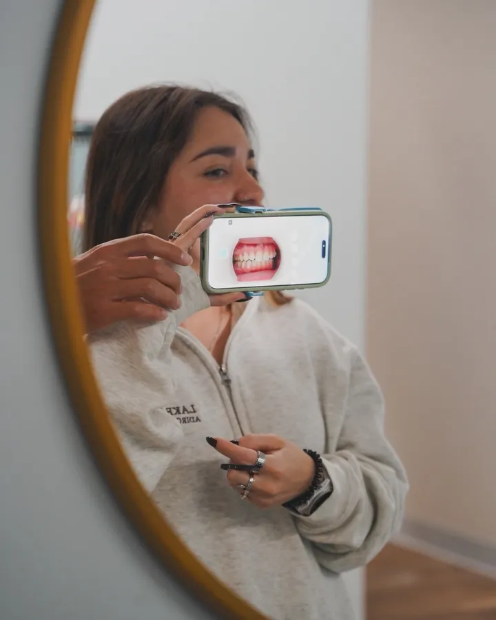 A patient using the WO On The Go app to submit a smile scan
