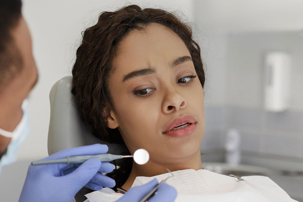 Young woman experiencing dental anxiety