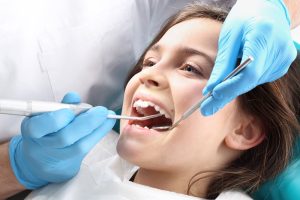 Young girl at orthodontics appointment | Early orthodontic treatment